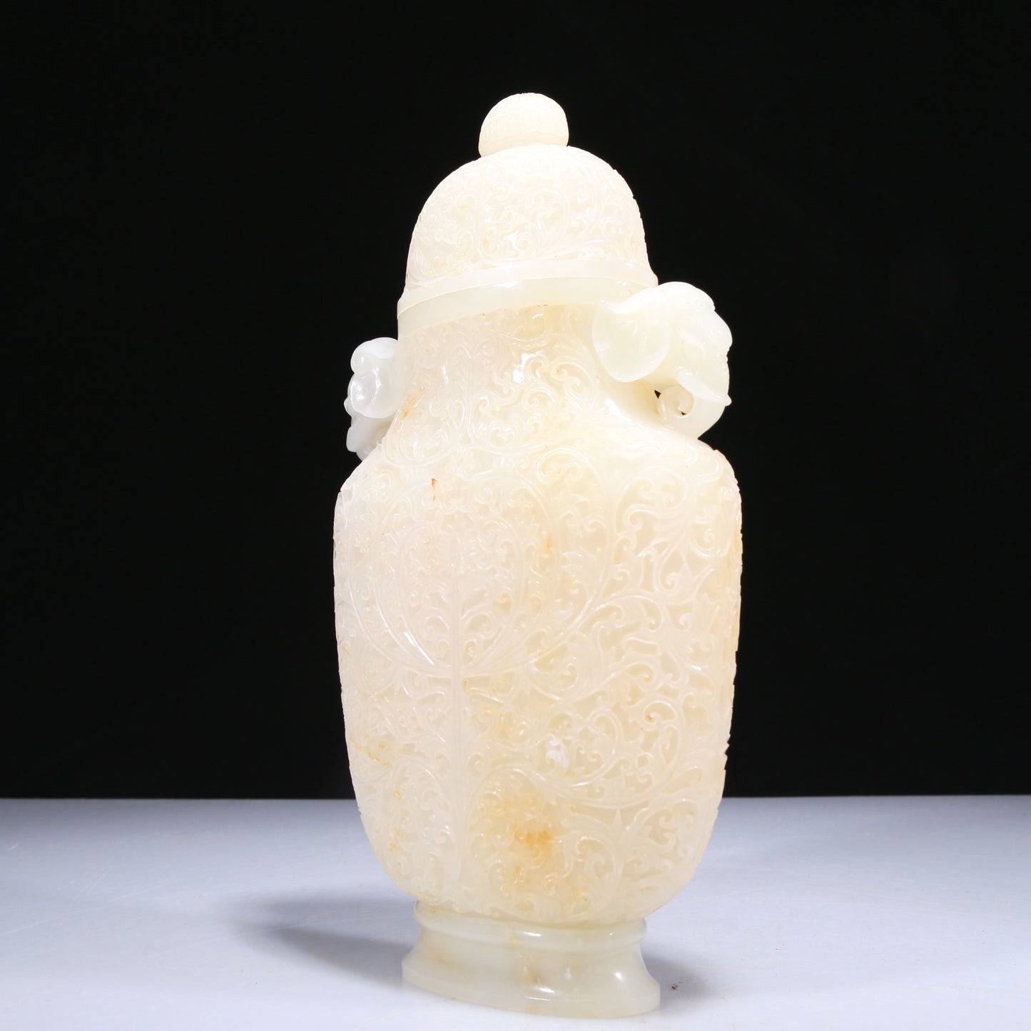 An Elaborate White Jade 'Scrolling Lotus' Elephant-Handled Vase