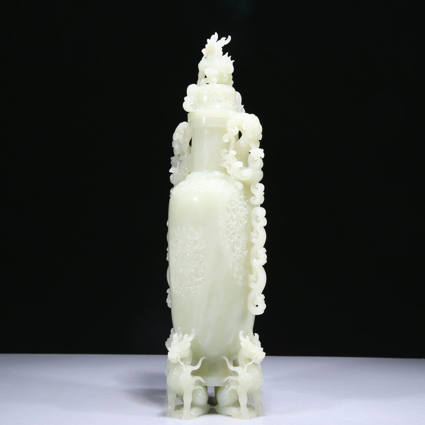 An Elaborate White Jade 'Kylin' Phoenix-Handled Vase