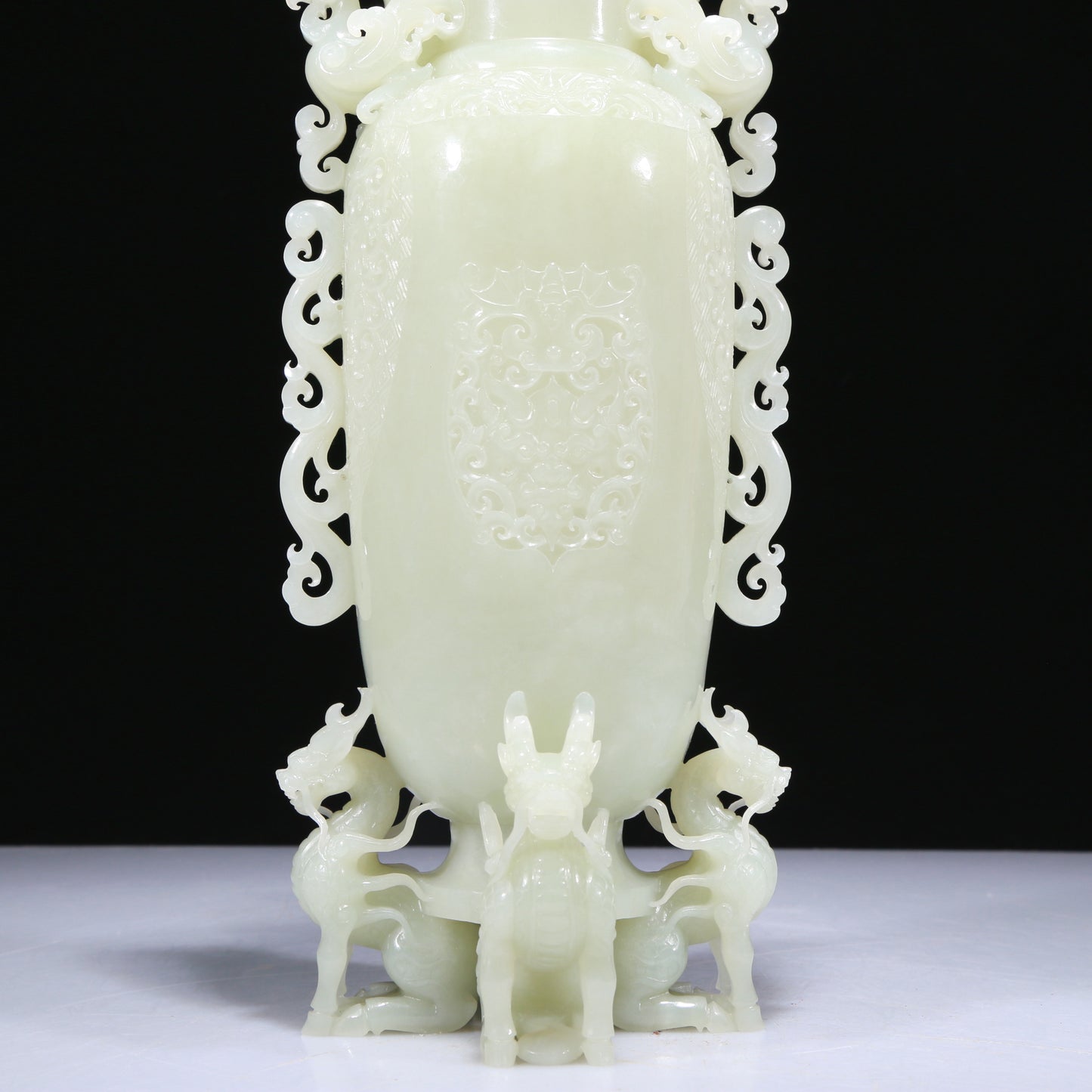 An Elaborate White Jade 'Kylin' Phoenix-Handled Vase