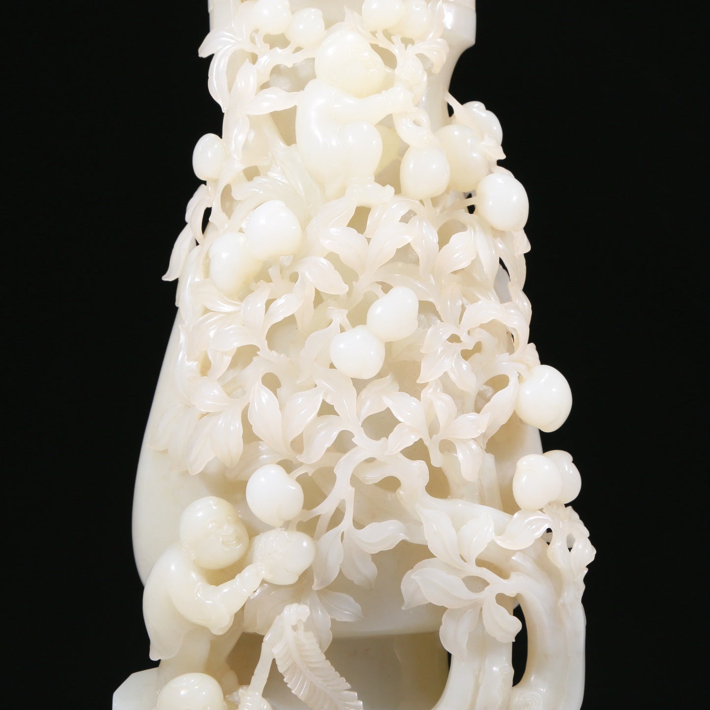 An Elaborate White Jade 'Figures Picking Peaches' Vase With Imperial Poem Inscriptions From Qianlong Period