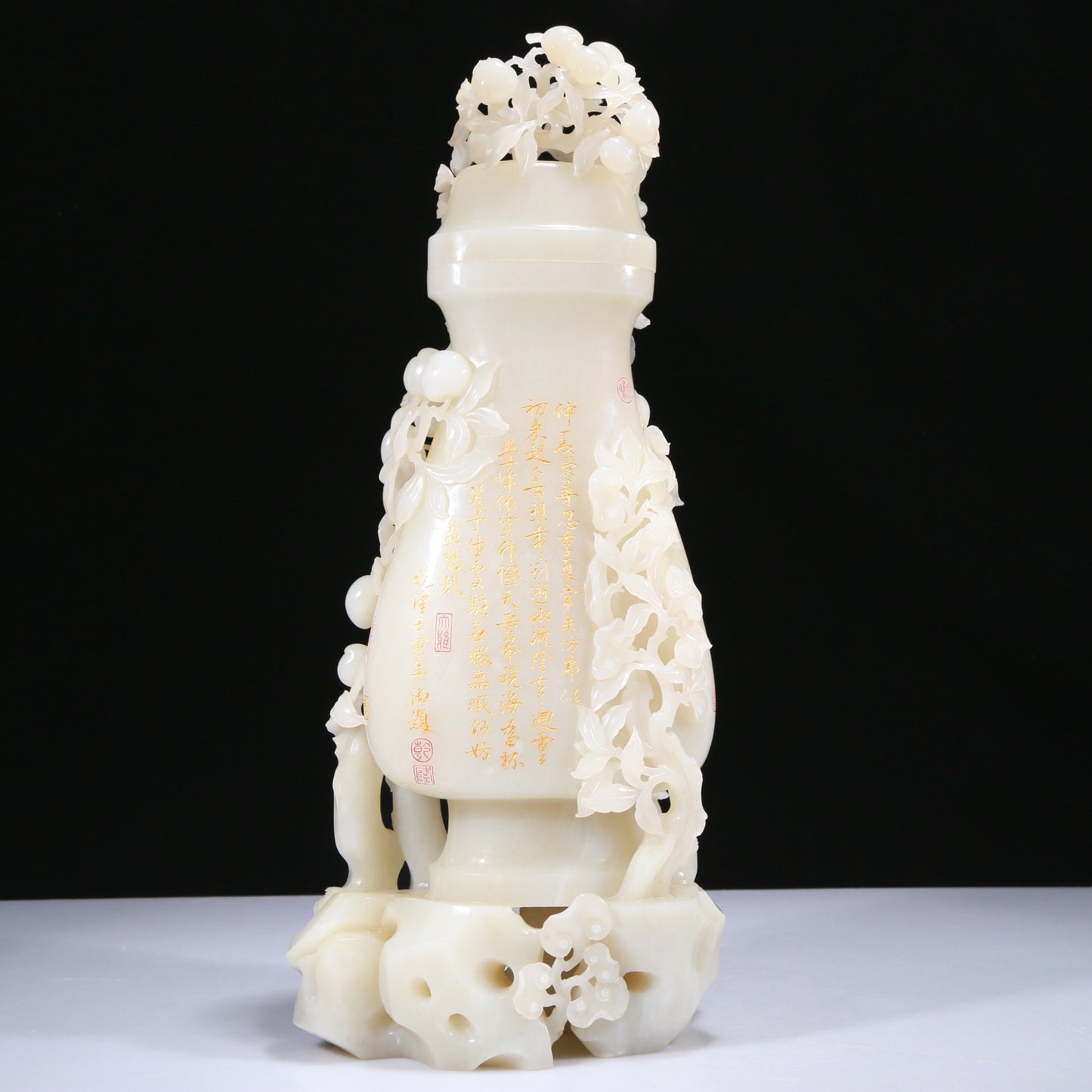 An Elaborate White Jade 'Figures Picking Peaches' Vase With Imperial Poem Inscriptions From Qianlong Period