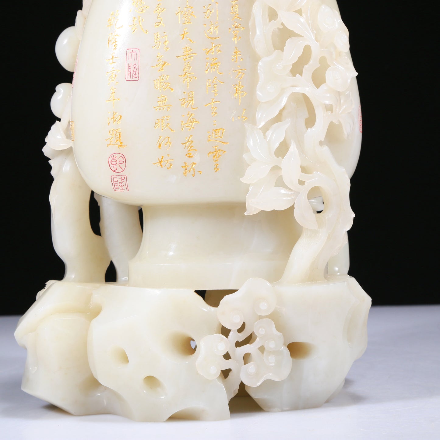 An Elaborate White Jade 'Figures Picking Peaches' Vase With Imperial Poem Inscriptions From Qianlong Period