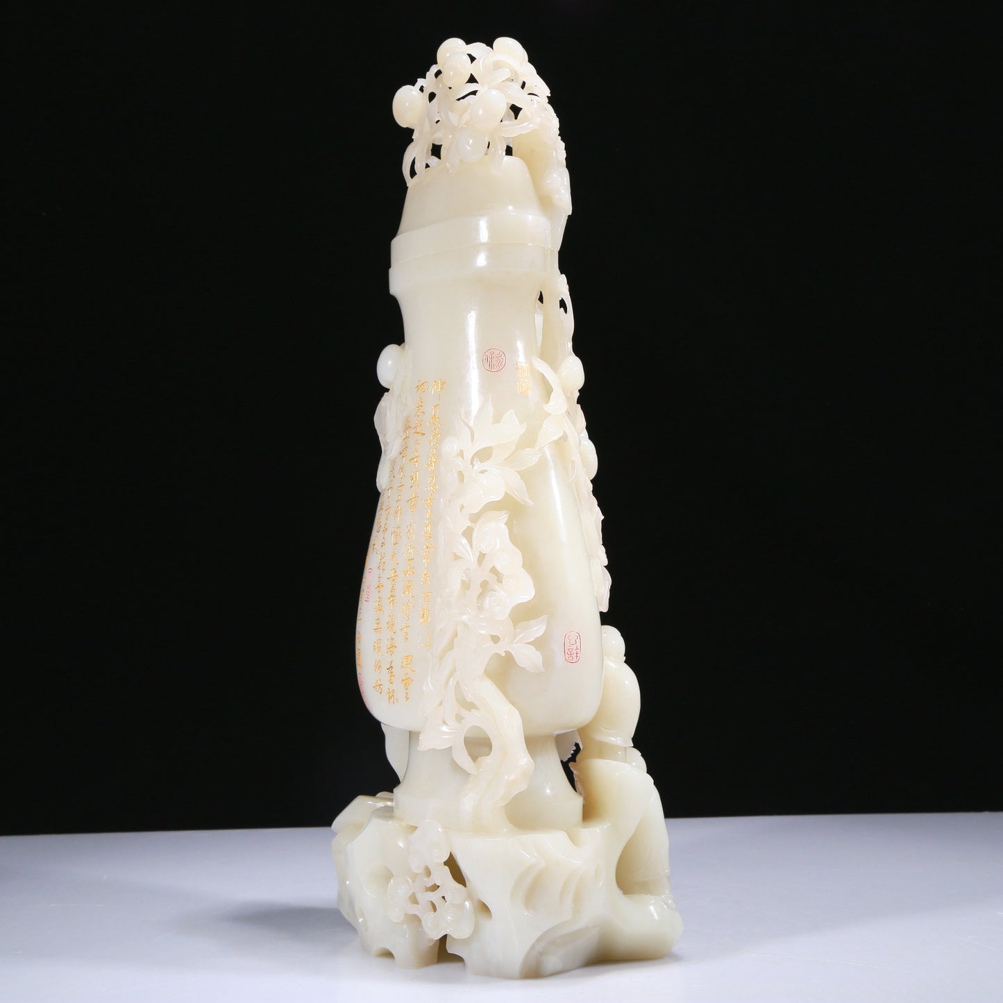 An Elaborate White Jade 'Figures Picking Peaches' Vase With Imperial Poem Inscriptions From Qianlong Period