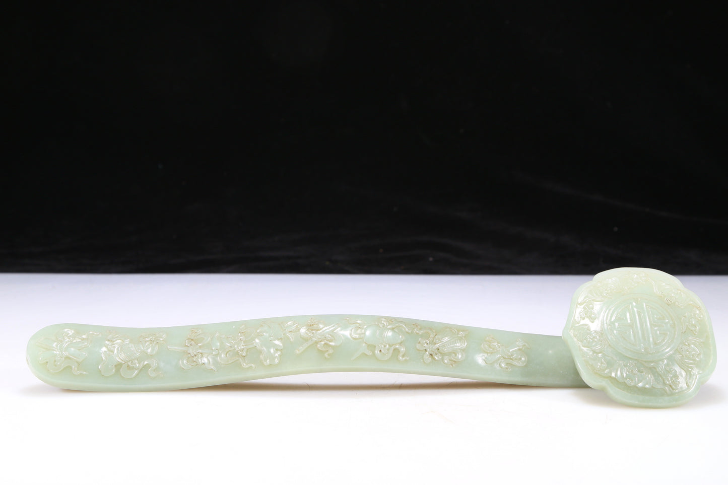 An Elaborate Imperial White Jade 'Weapons Of The Eight Immortals' Ruyi Scepter With Poem Inscriptions