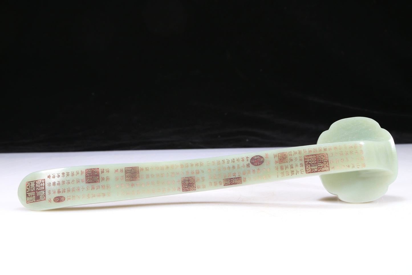 An Elaborate Imperial White Jade 'Weapons Of The Eight Immortals' Ruyi Scepter With Poem Inscriptions