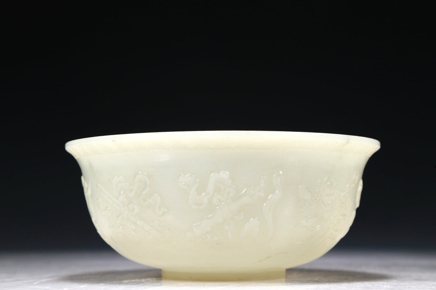 A Marvelous White Jade 'Weapons Of The Eight Immortals' Bowl