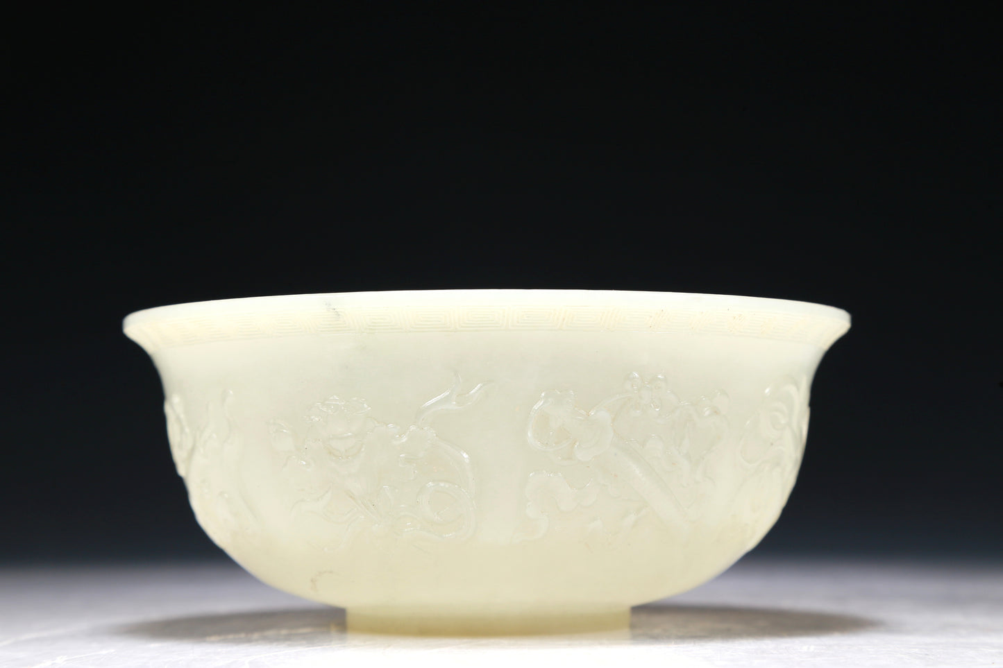 A Marvelous White Jade 'Weapons Of The Eight Immortals' Bowl