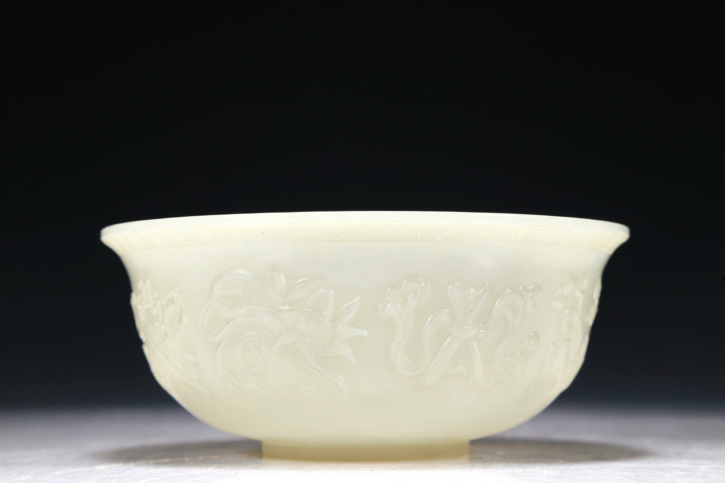 A Marvelous White Jade 'Weapons Of The Eight Immortals' Bowl