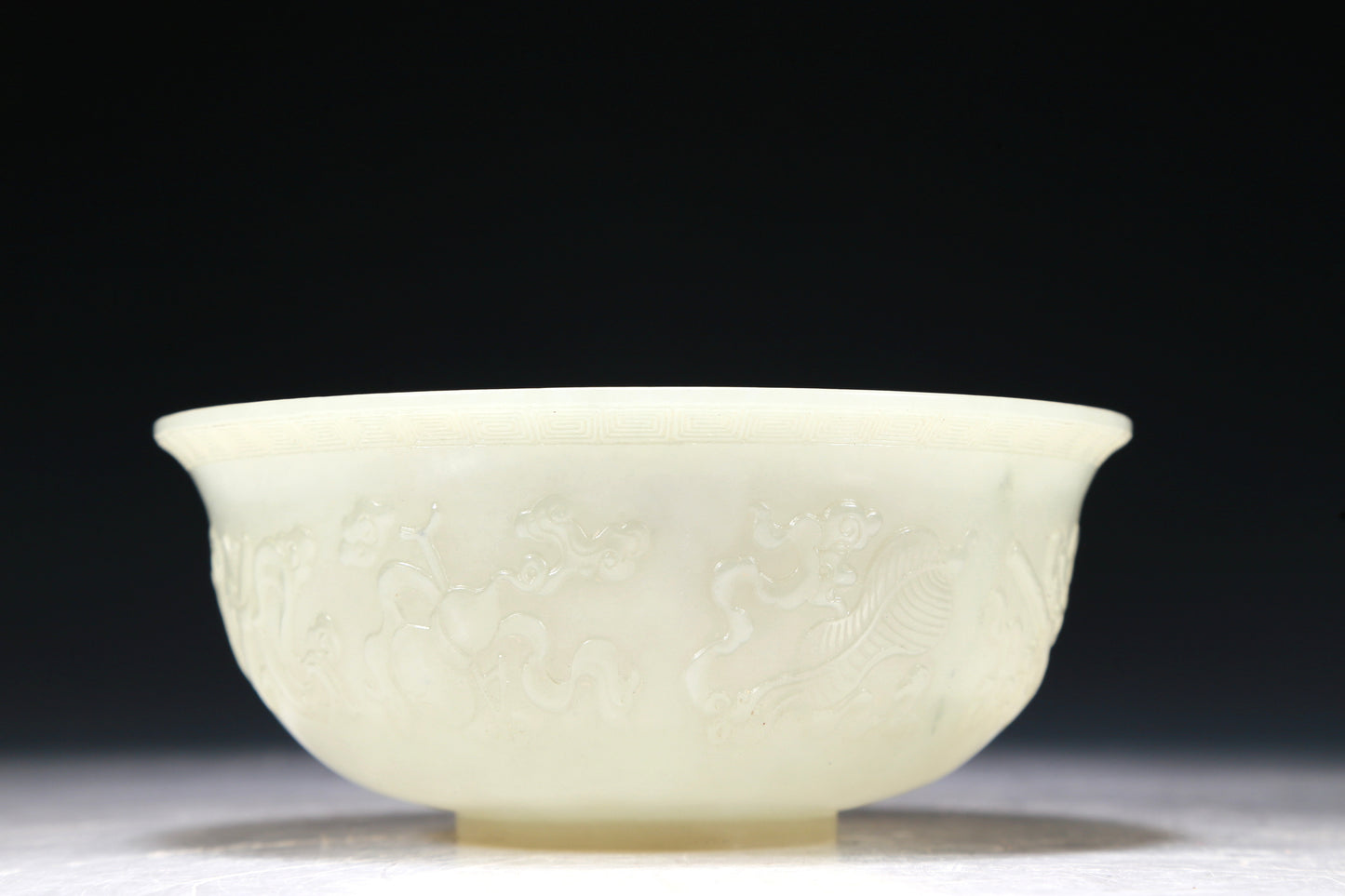 A Marvelous White Jade 'Weapons Of The Eight Immortals' Bowl