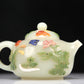 A Superb Imperial White Jade Gem-Inlaid 'Bird& Flower' Teapot