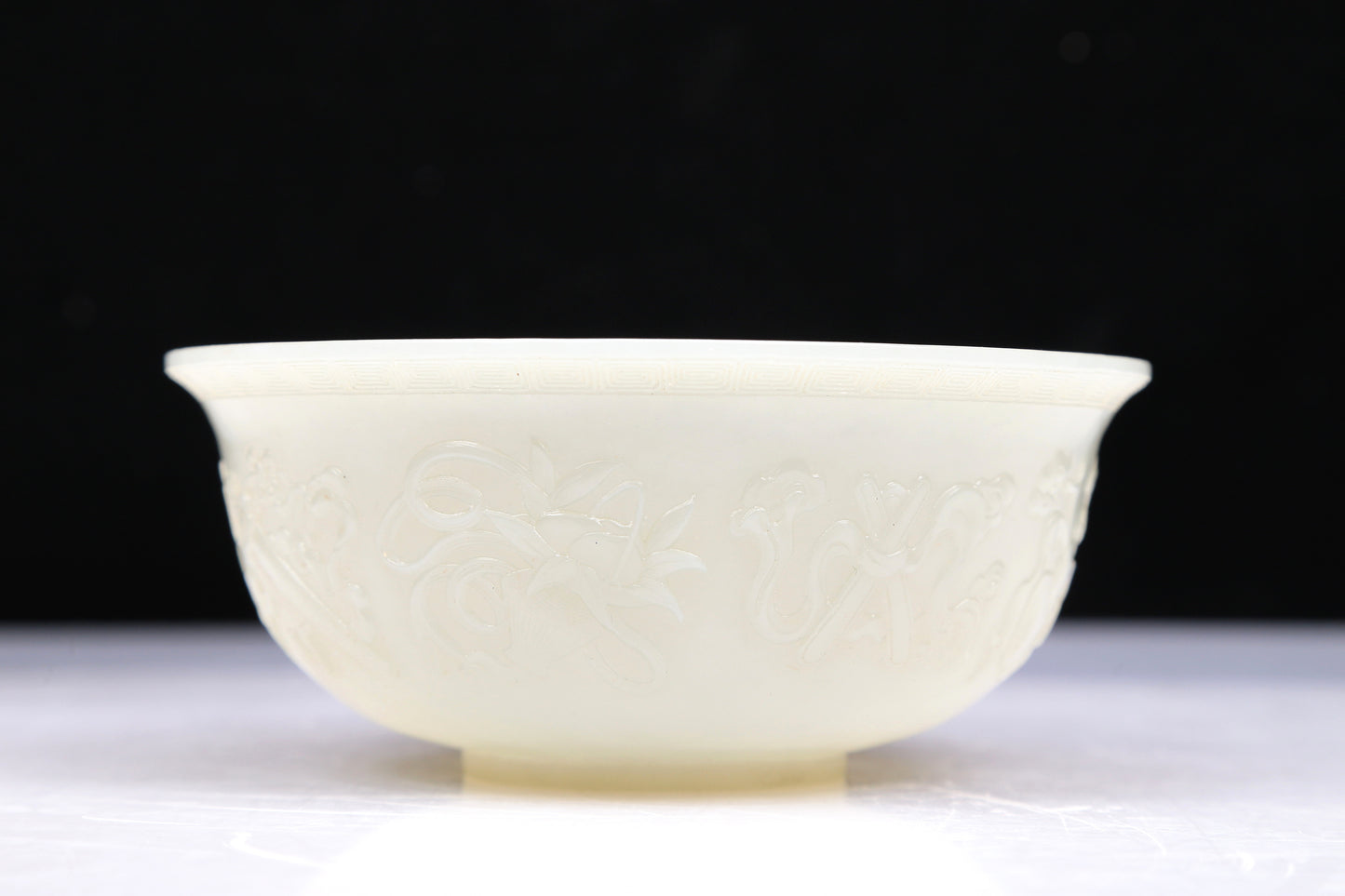 An Excellent White Jade 'Weapons Of The Eight Immortals' Bowl