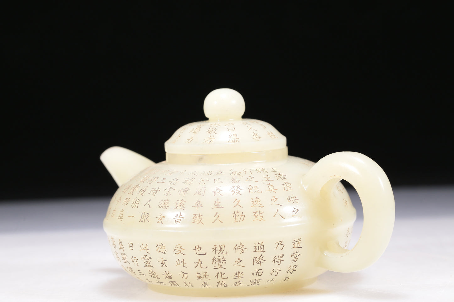 A Brilliant White Jade 'Poem' Teapot With Four Miniature Teacups