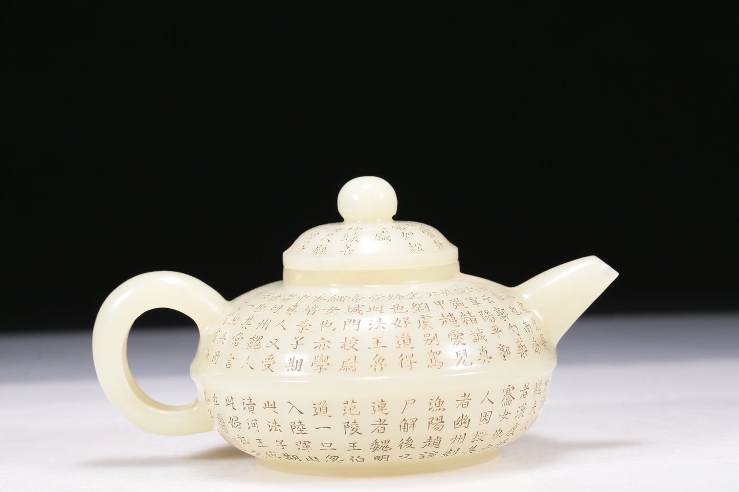 A Brilliant White Jade 'Poem' Teapot With Four Miniature Teacups