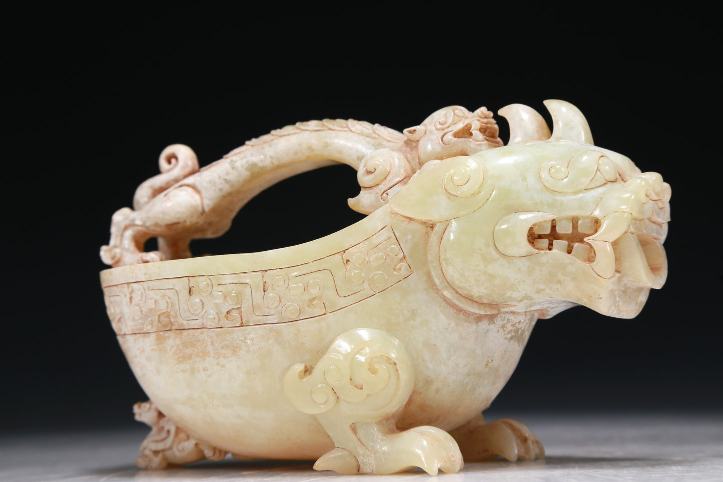 A Marvelous White Jade 'Auspicious Beast' Ewer