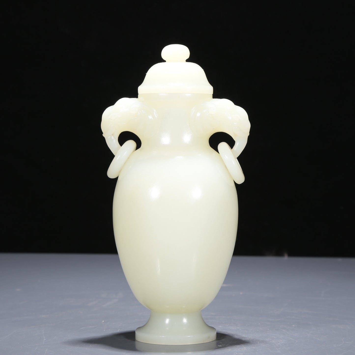 A Precious White Jade Elephant-Handled Vase And Cover