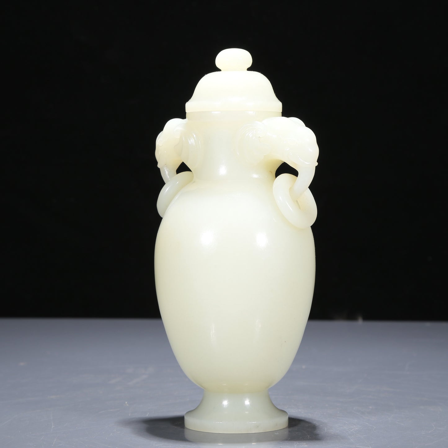 A Precious White Jade Elephant-Handled Vase And Cover