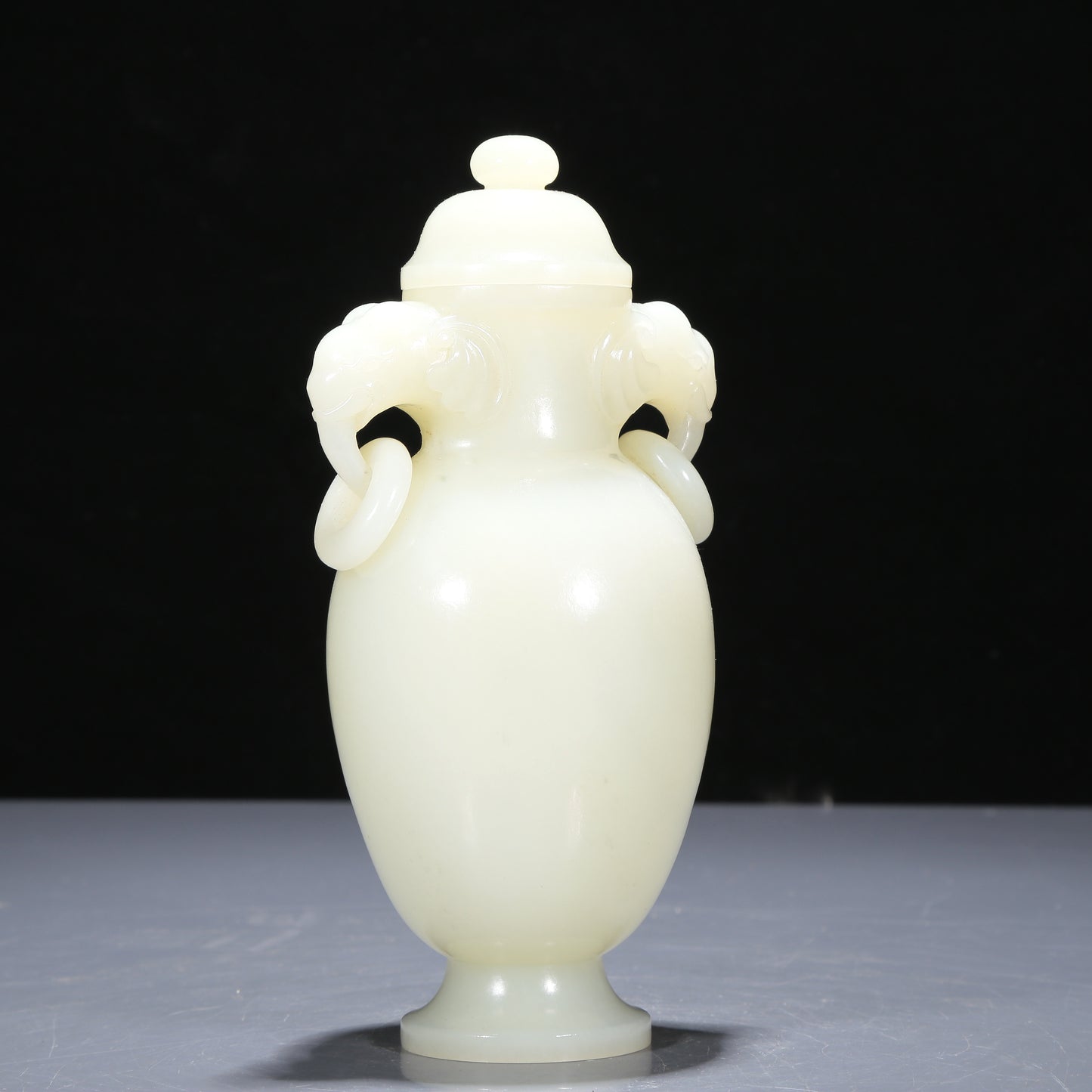 A Precious White Jade Elephant-Handled Vase And Cover