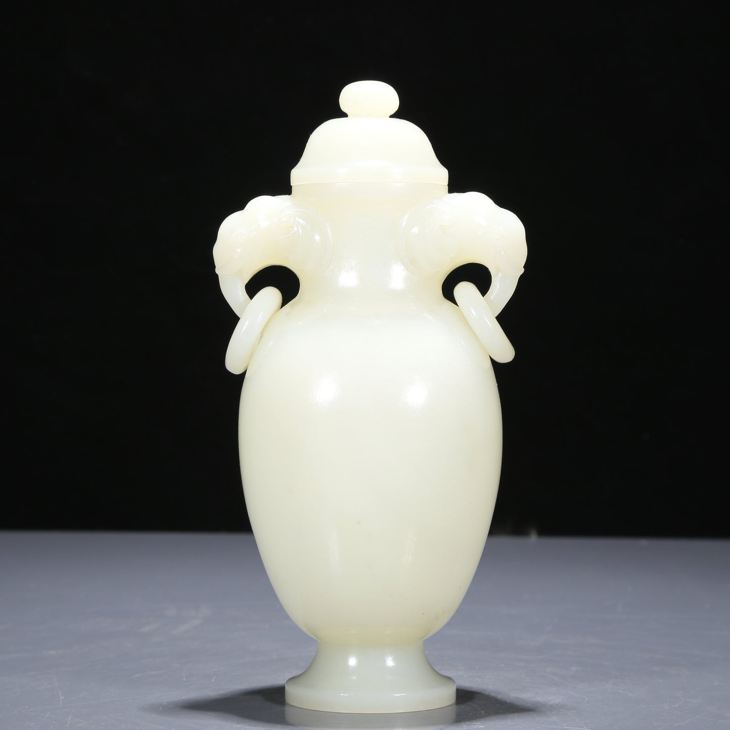 A Precious White Jade Elephant-Handled Vase And Cover