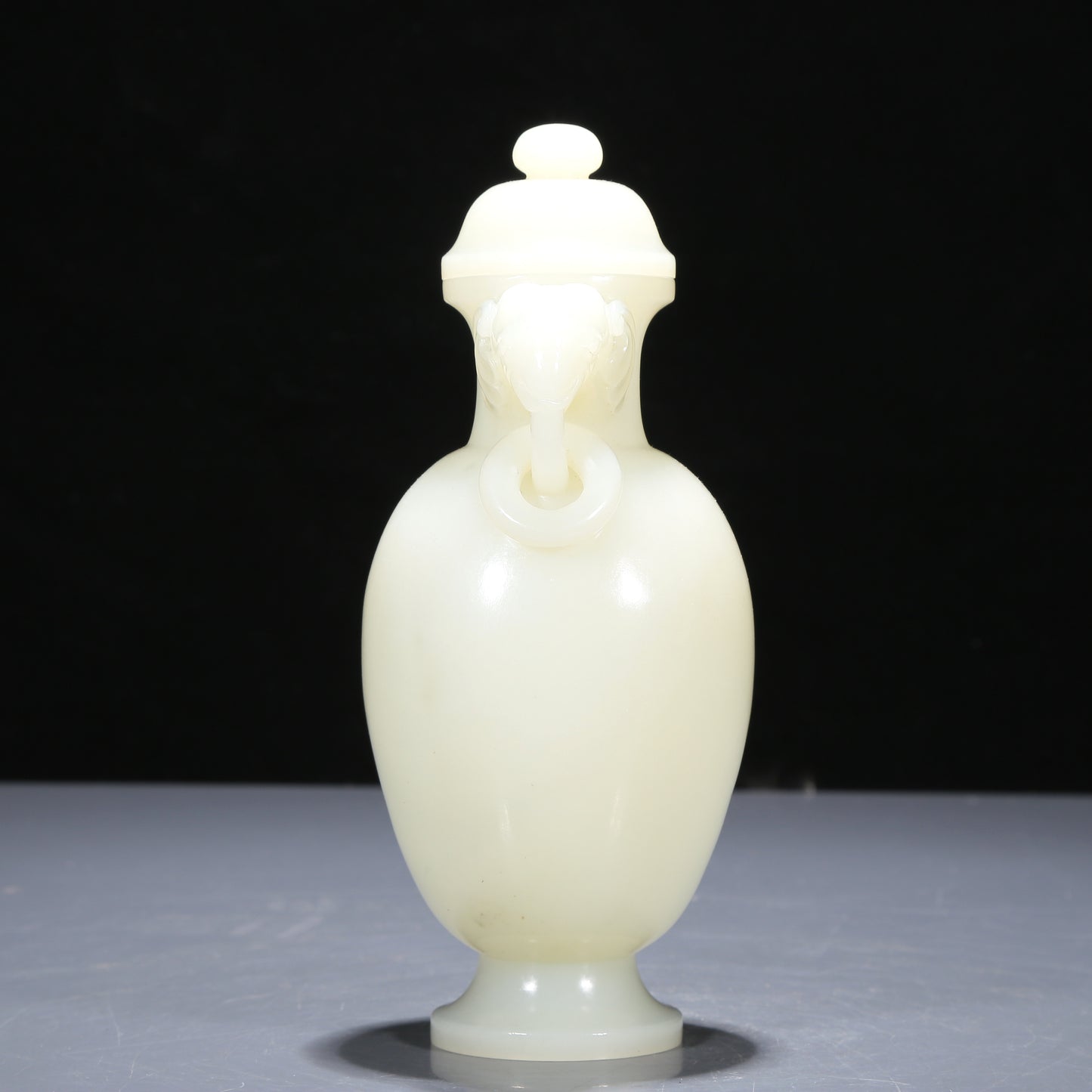 A Precious White Jade Elephant-Handled Vase And Cover