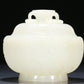 An Exquisite White Jade 'Weapons Of The Eight Immortals' Jar And Cover