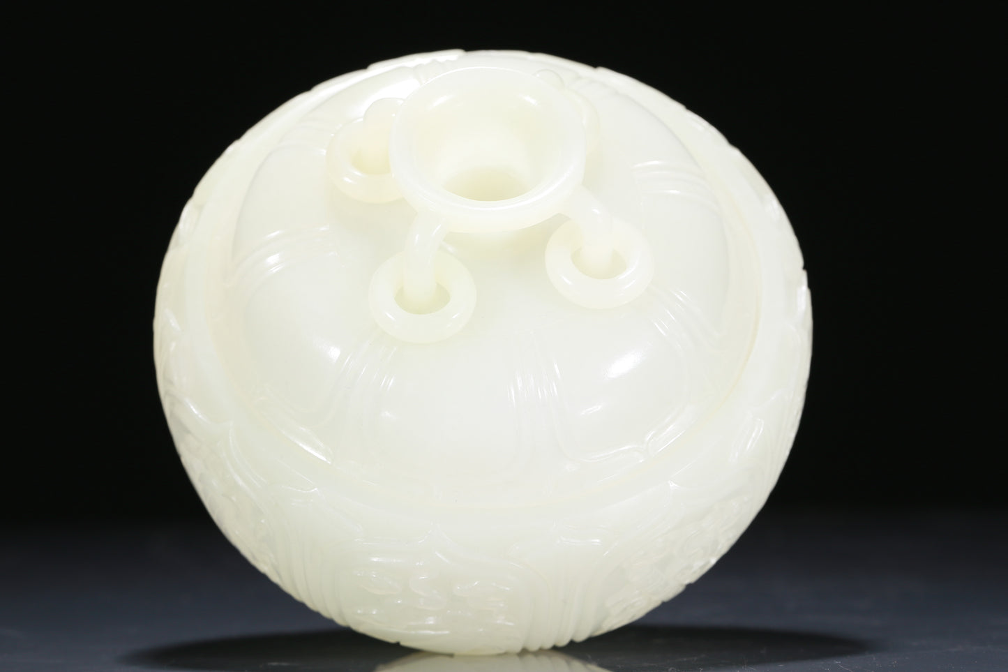 An Exquisite White Jade 'Weapons Of The Eight Immortals' Jar And Cover