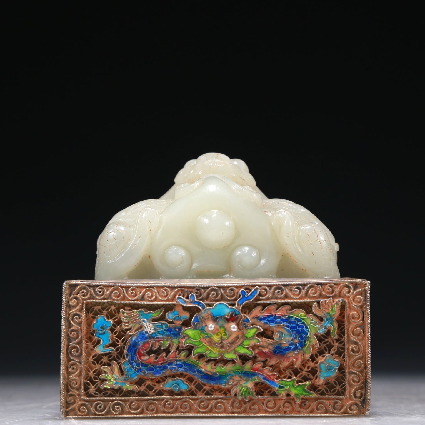 A Marvelous White Jade Gold-Mounted Blueing 'Dragon' Seal With A Gilt-Bronze 'Scrolling Lotus& Dragon' Handle And Stand