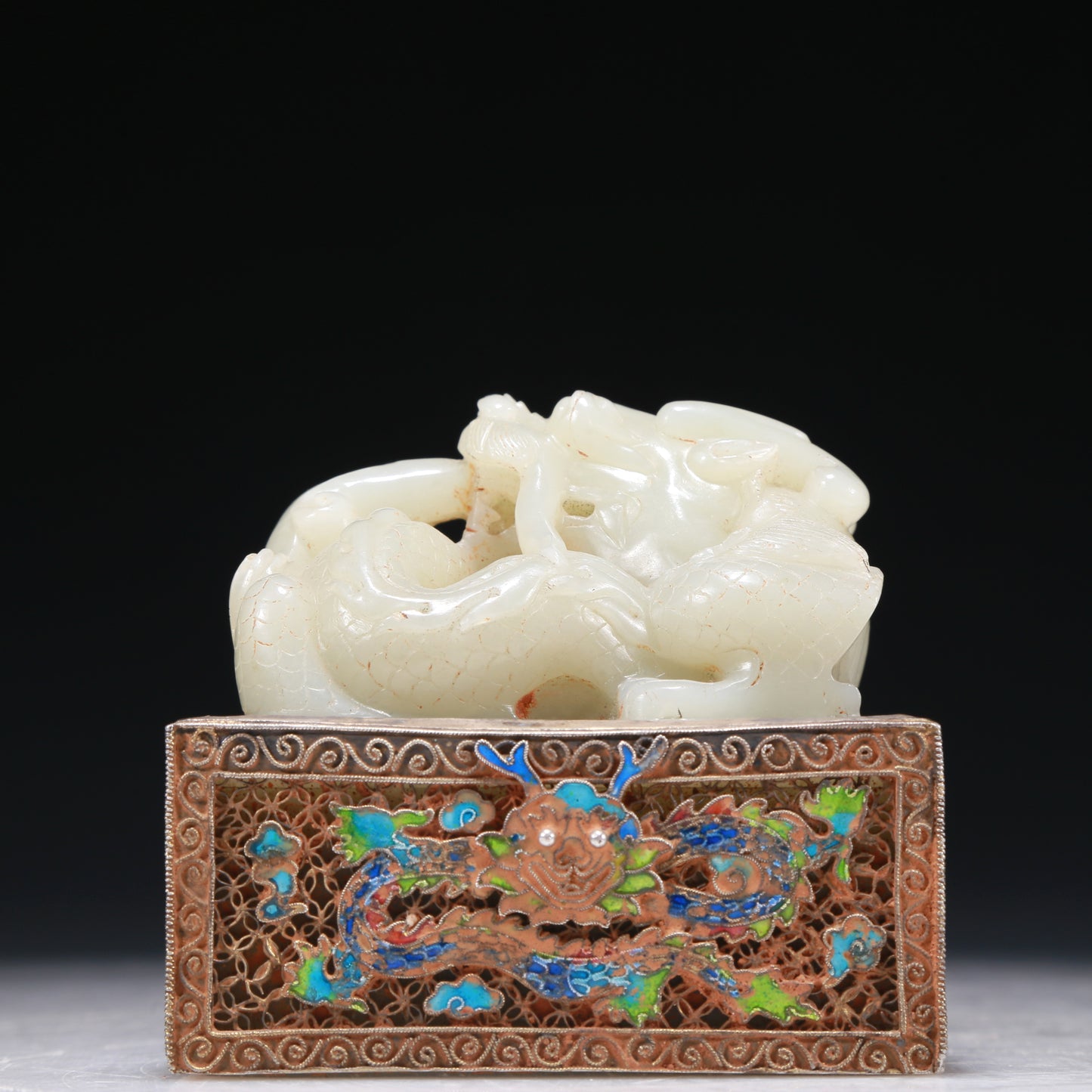 A Marvelous White Jade Gold-Mounted Blueing 'Dragon' Seal With A Gilt-Bronze 'Scrolling Lotus& Dragon' Handle And Stand