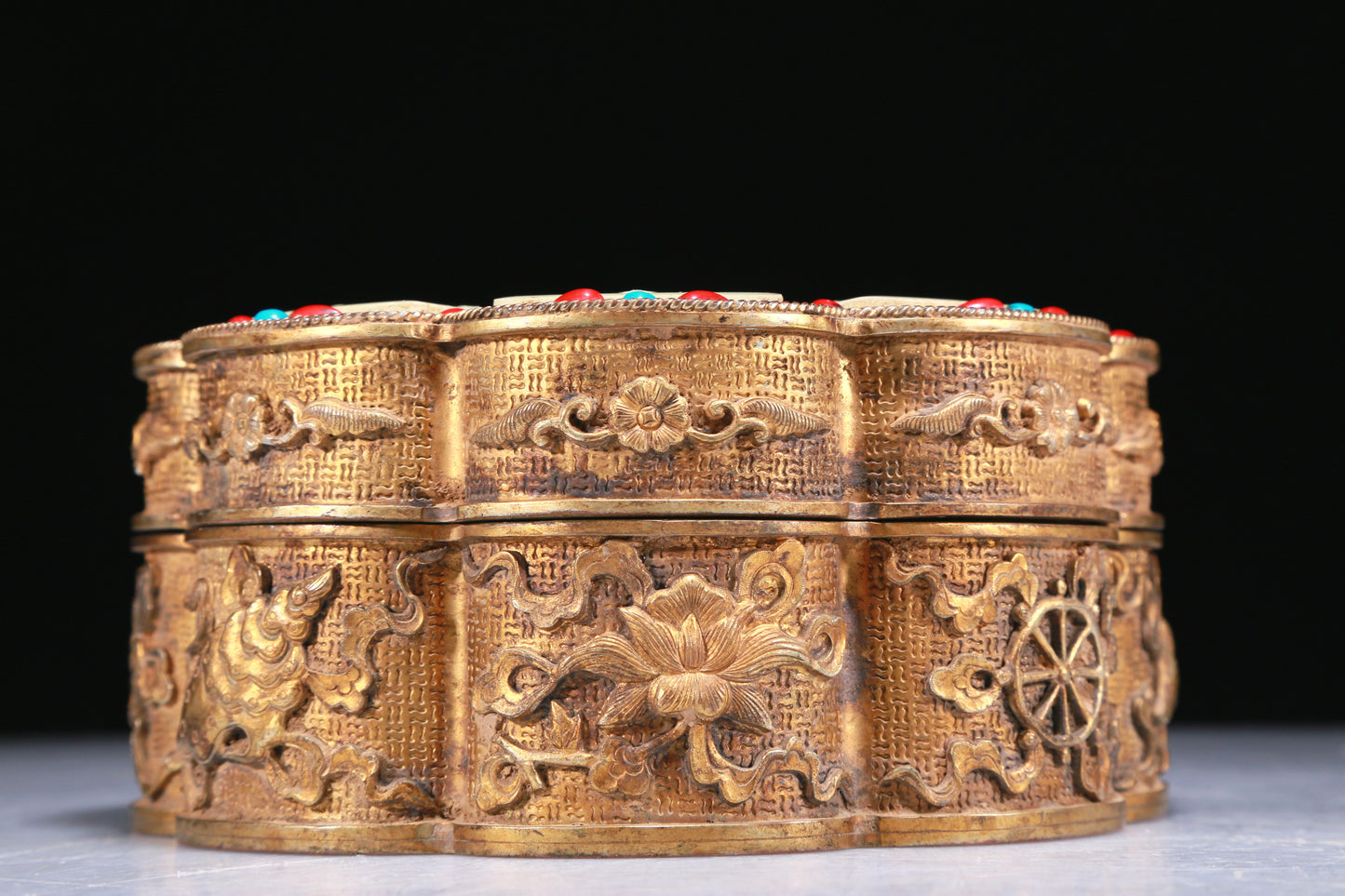 An Elaborate Gilt-Bronze White Jade-Inlaid 'Weapons Of The Eight Immortals' Box