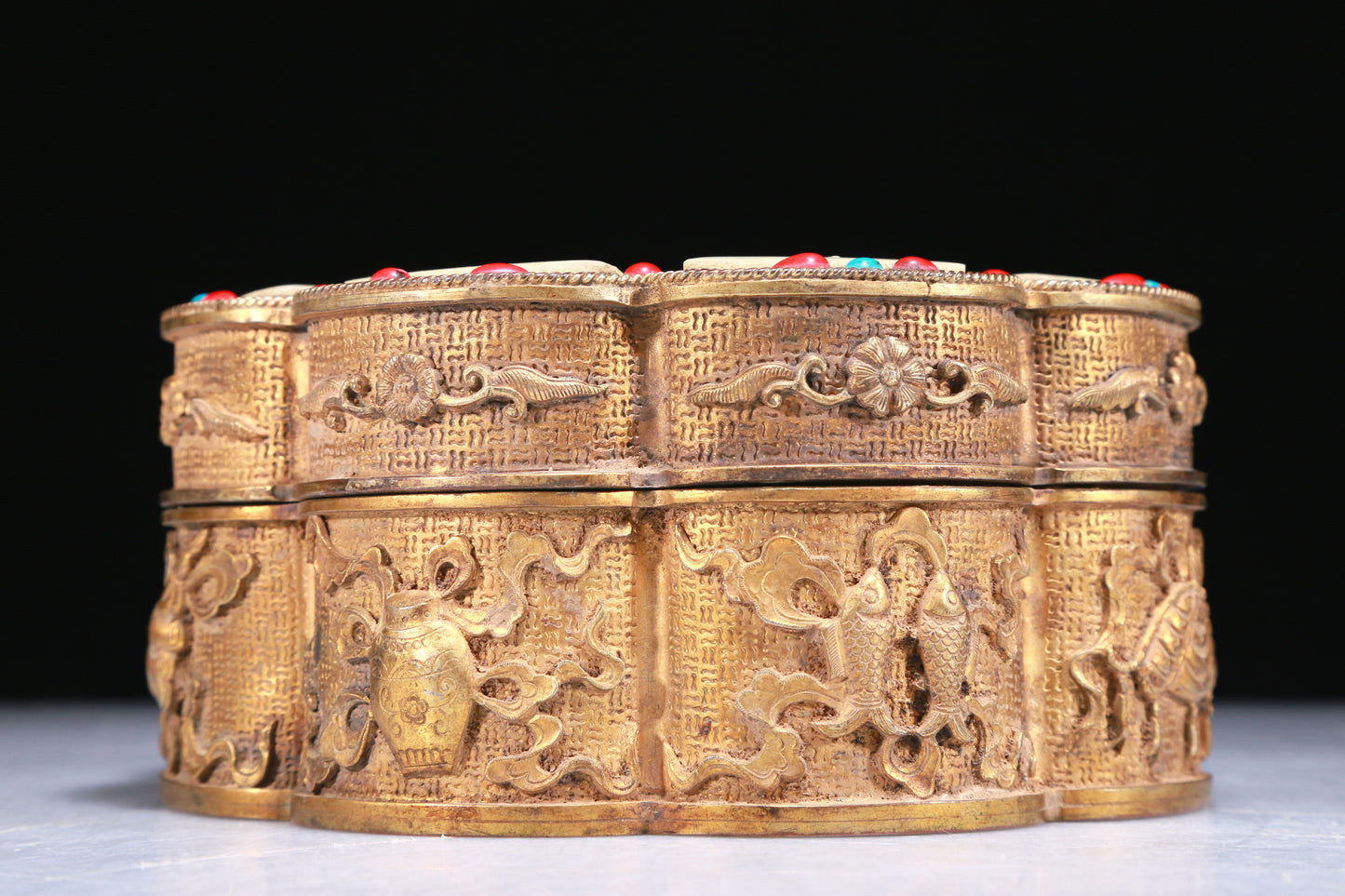 An Elaborate Gilt-Bronze White Jade-Inlaid 'Weapons Of The Eight Immortals' Box