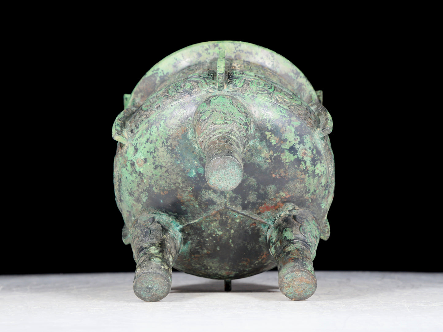 A precious bronze animal-faced two-eared and tripod furnace