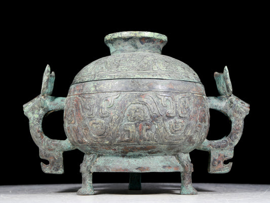 A precious bronze two-eared tripod furnace with auspicious animal patterns and a lid