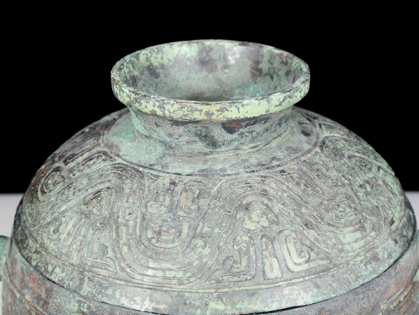 A precious bronze two-eared tripod furnace with auspicious animal patterns and a lid