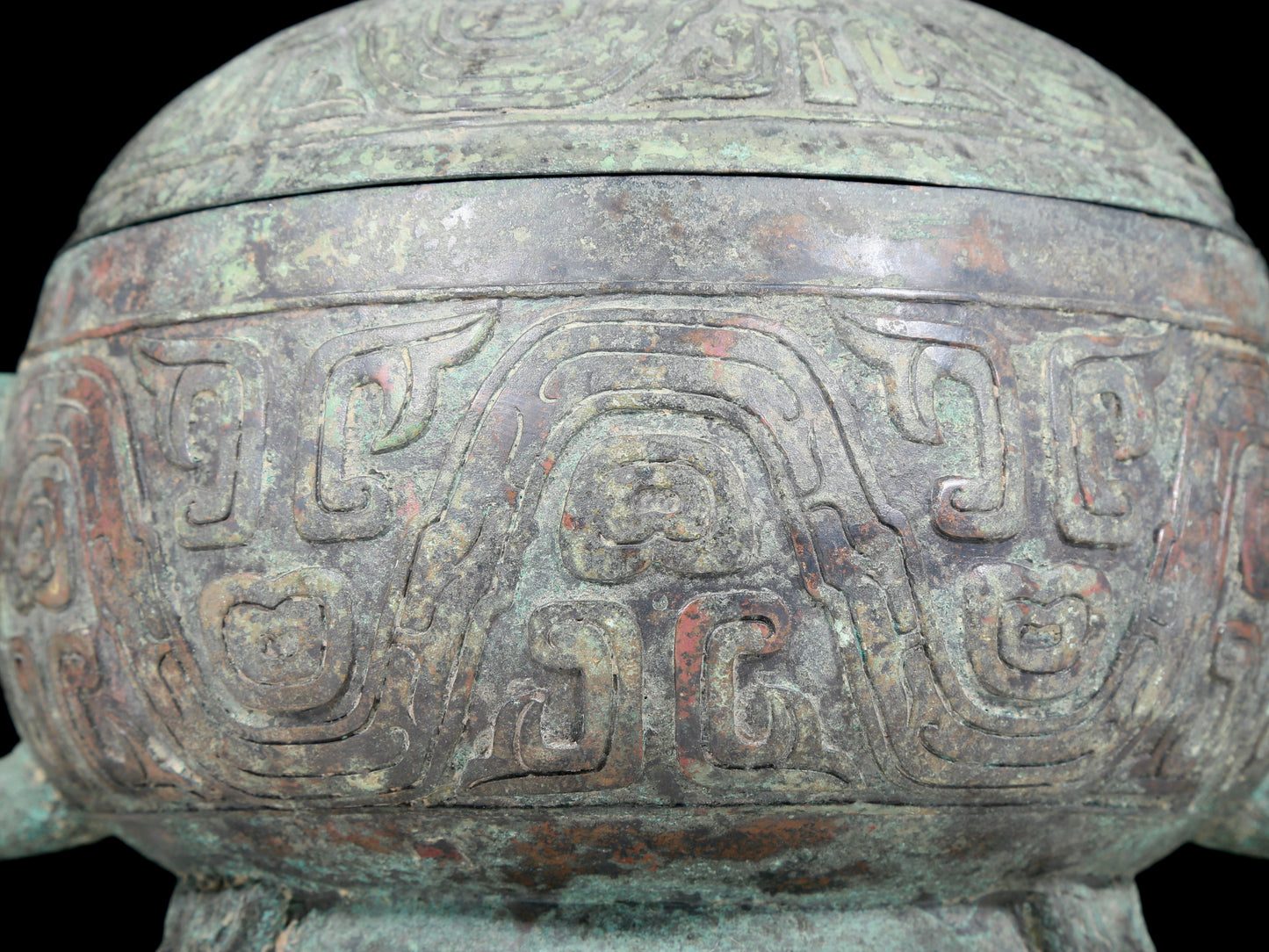 A precious bronze two-eared tripod furnace with auspicious animal patterns and a lid