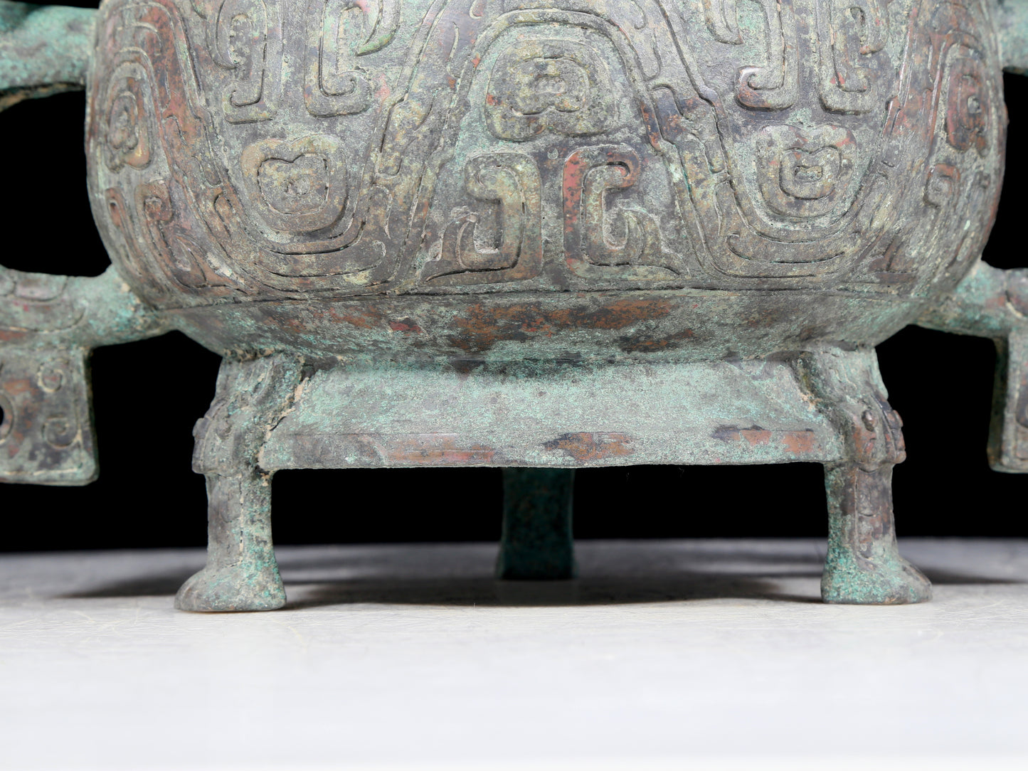 A precious bronze two-eared tripod furnace with auspicious animal patterns and a lid