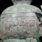 A precious bronze two-eared tripod furnace with auspicious animal patterns and a lid