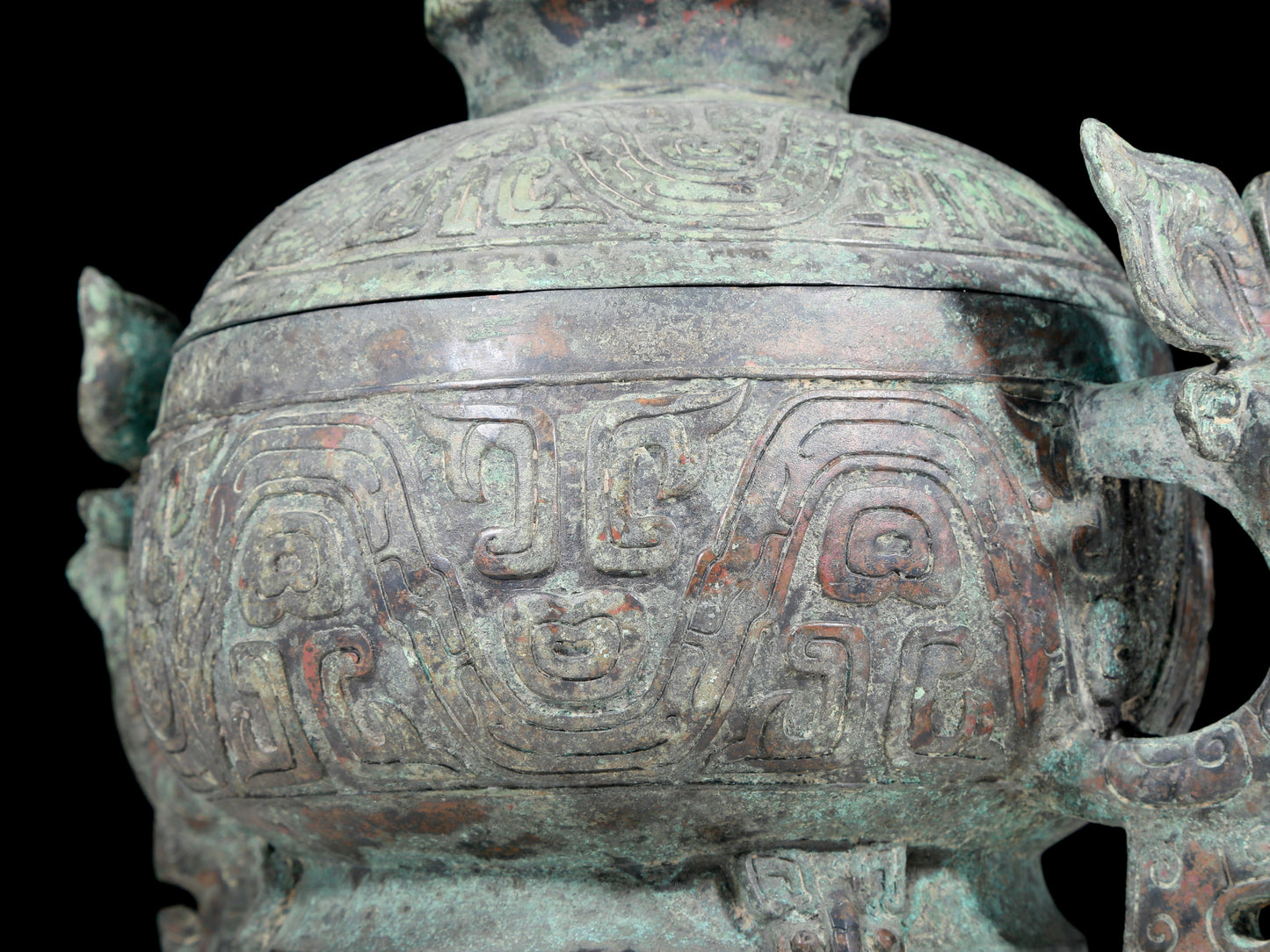 A precious bronze two-eared tripod furnace with auspicious animal patterns and a lid