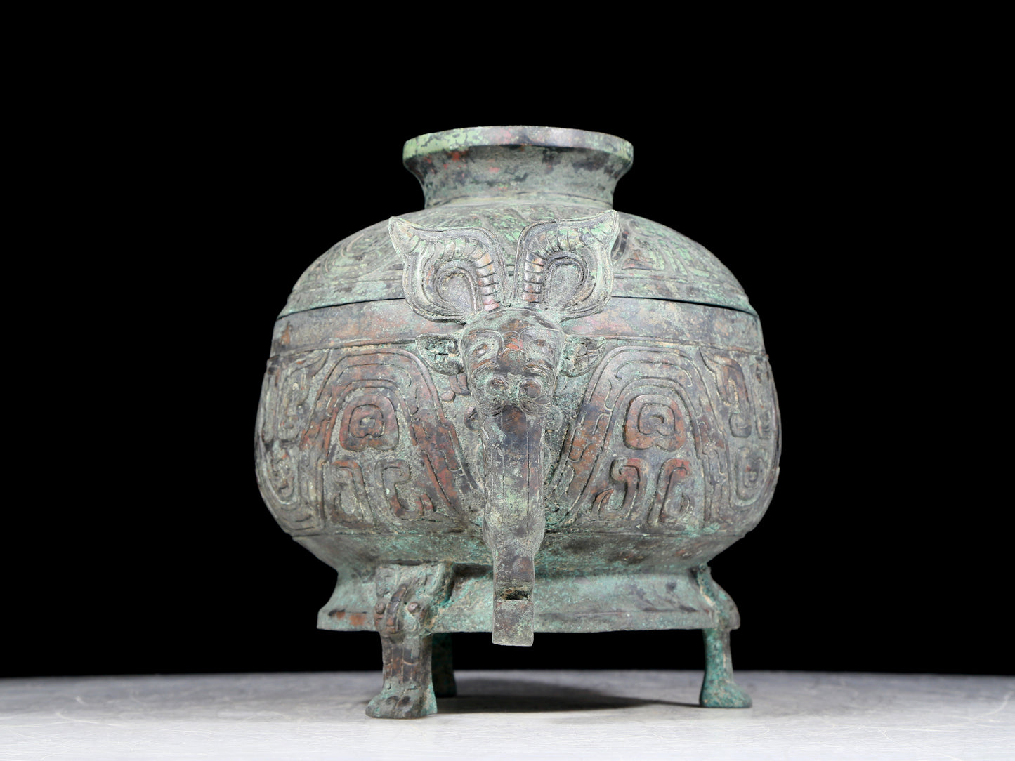 A precious bronze two-eared tripod furnace with auspicious animal patterns and a lid