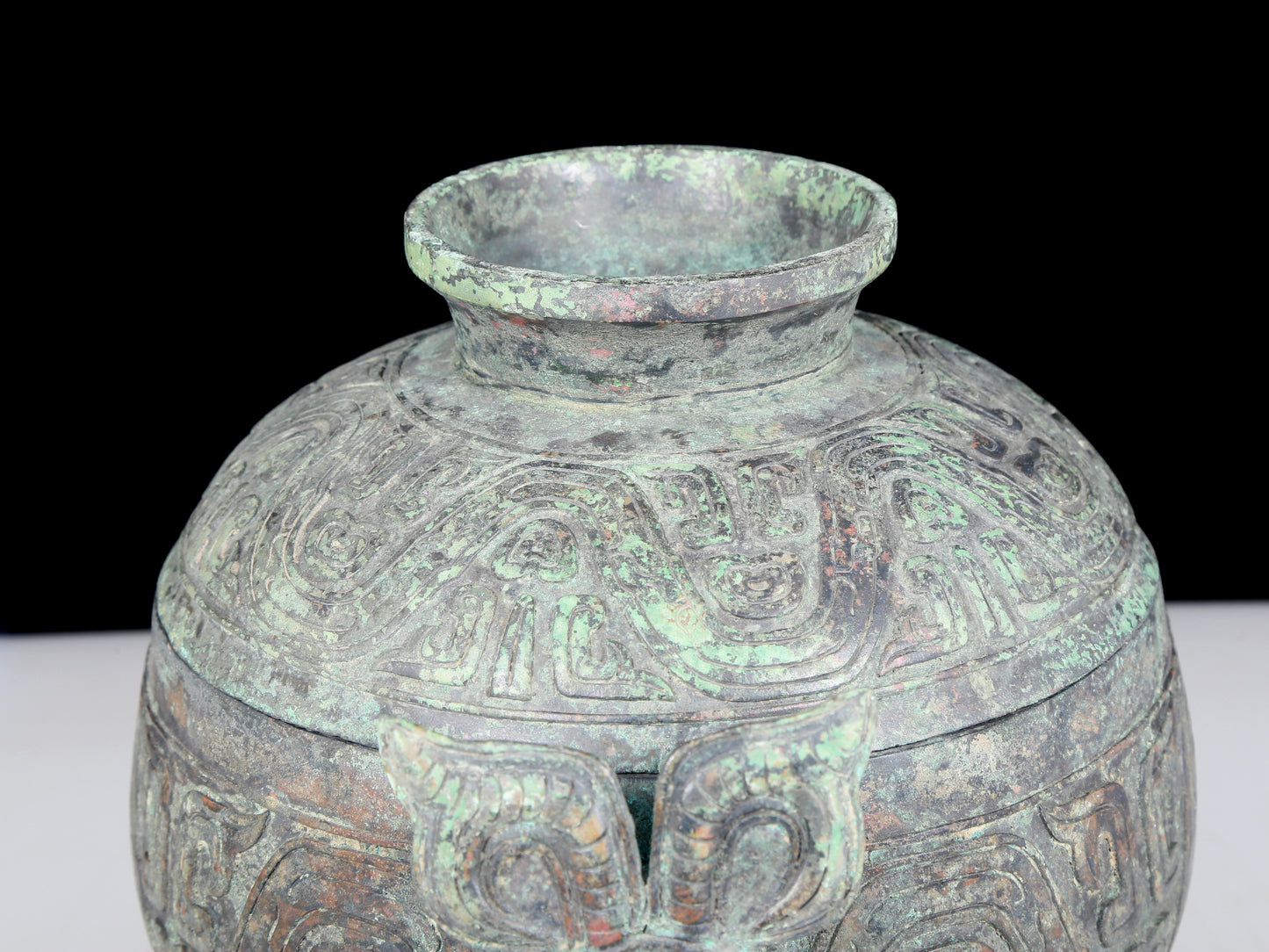 A precious bronze two-eared tripod furnace with auspicious animal patterns and a lid