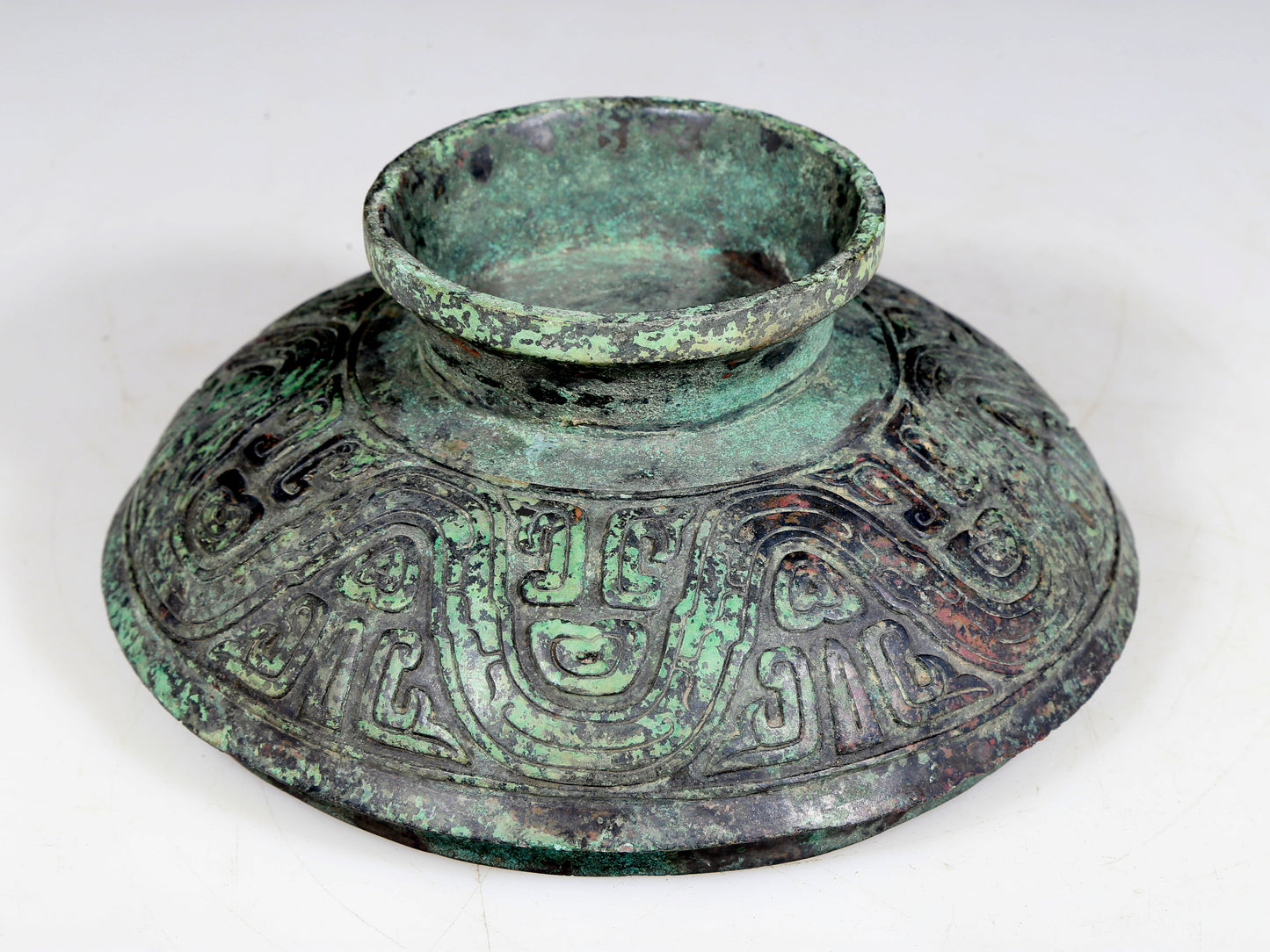 A precious bronze two-eared tripod furnace with auspicious animal patterns and a lid