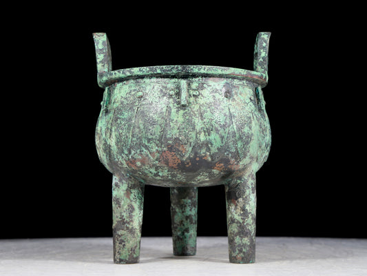 A precious bronze animal-faced two-eared and tripod furnace