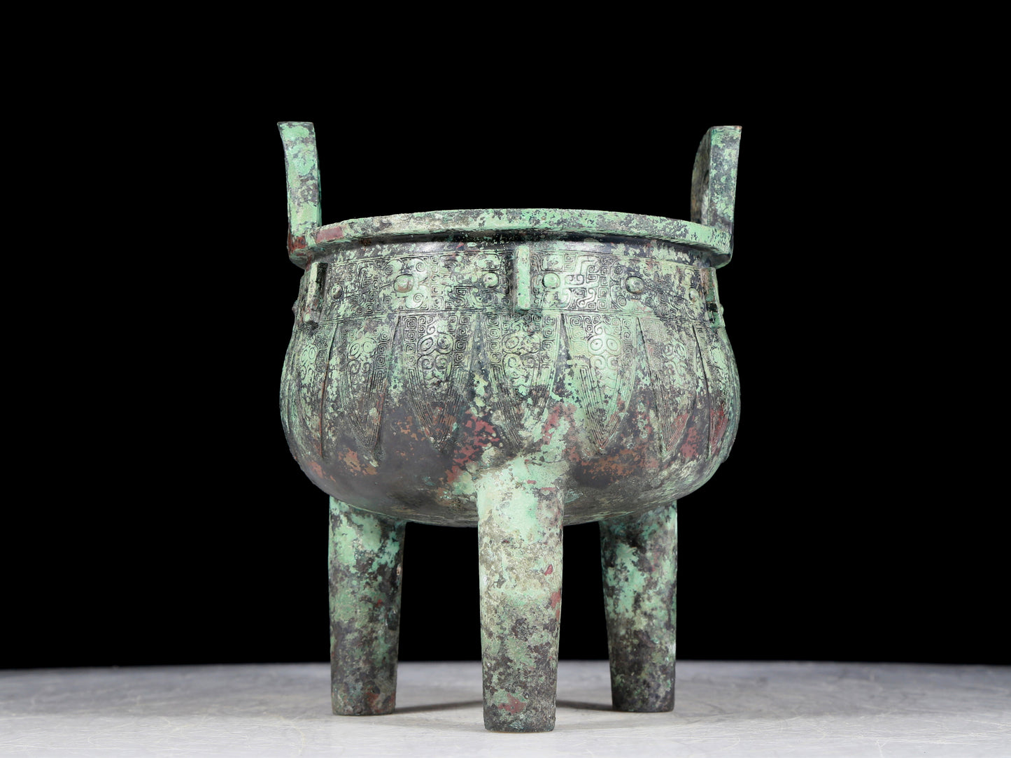 A precious bronze animal-faced two-eared and tripod furnace