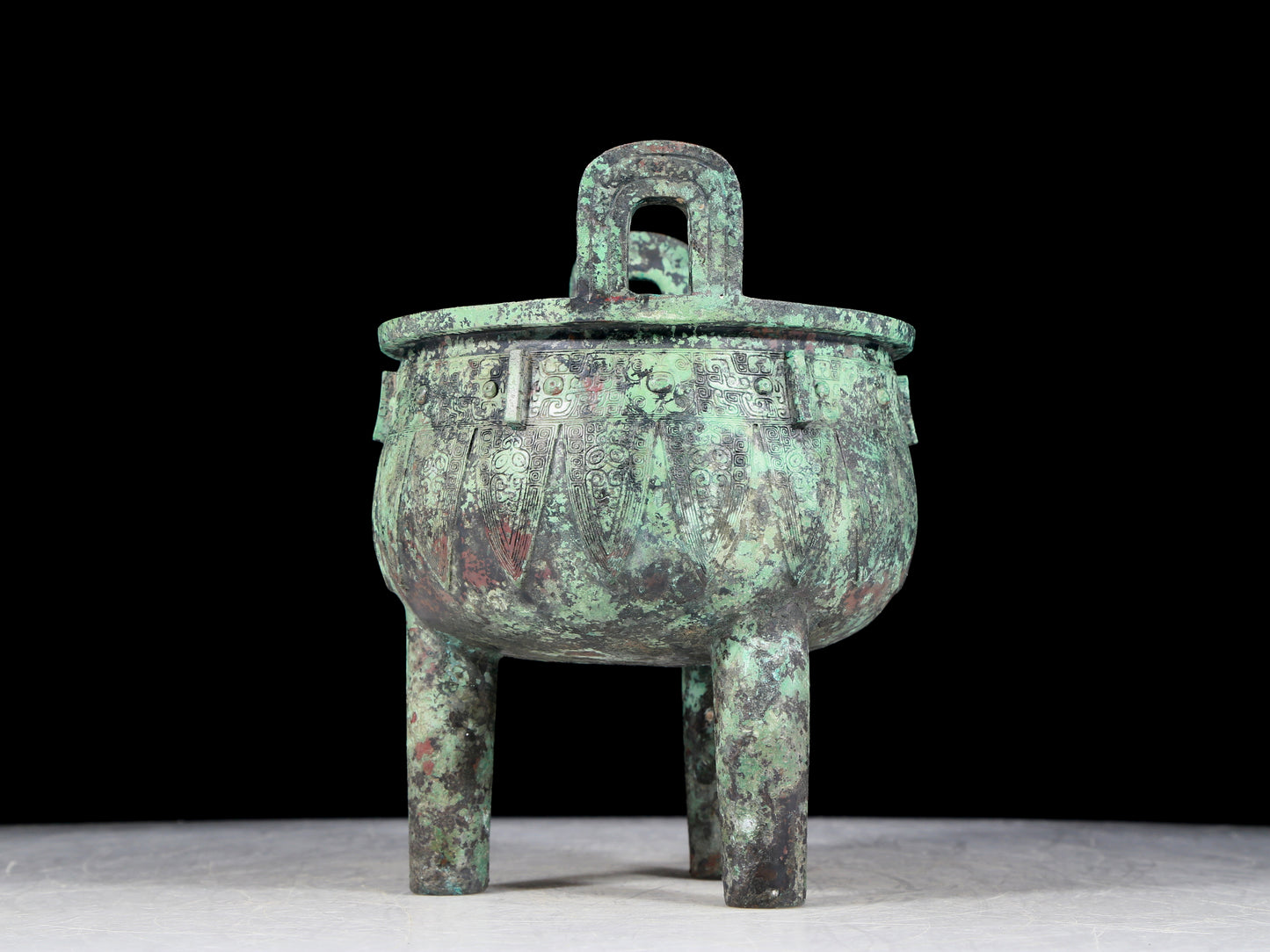 A precious bronze animal-faced two-eared and tripod furnace