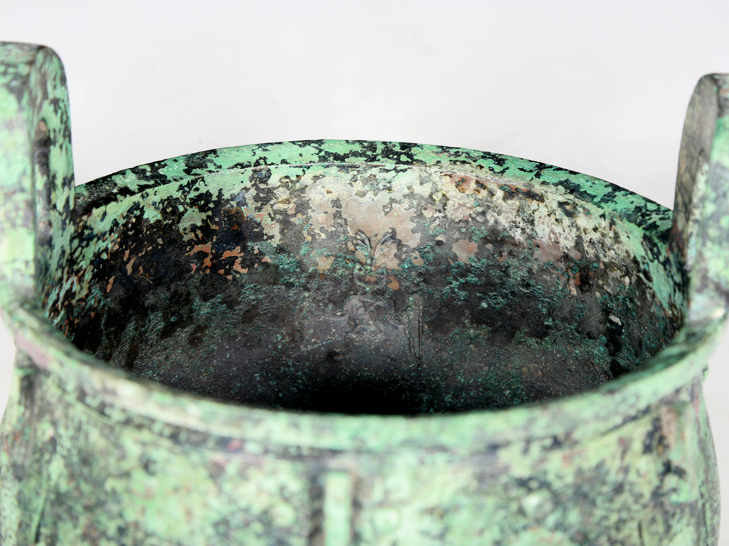 A precious bronze animal-faced two-eared and tripod furnace