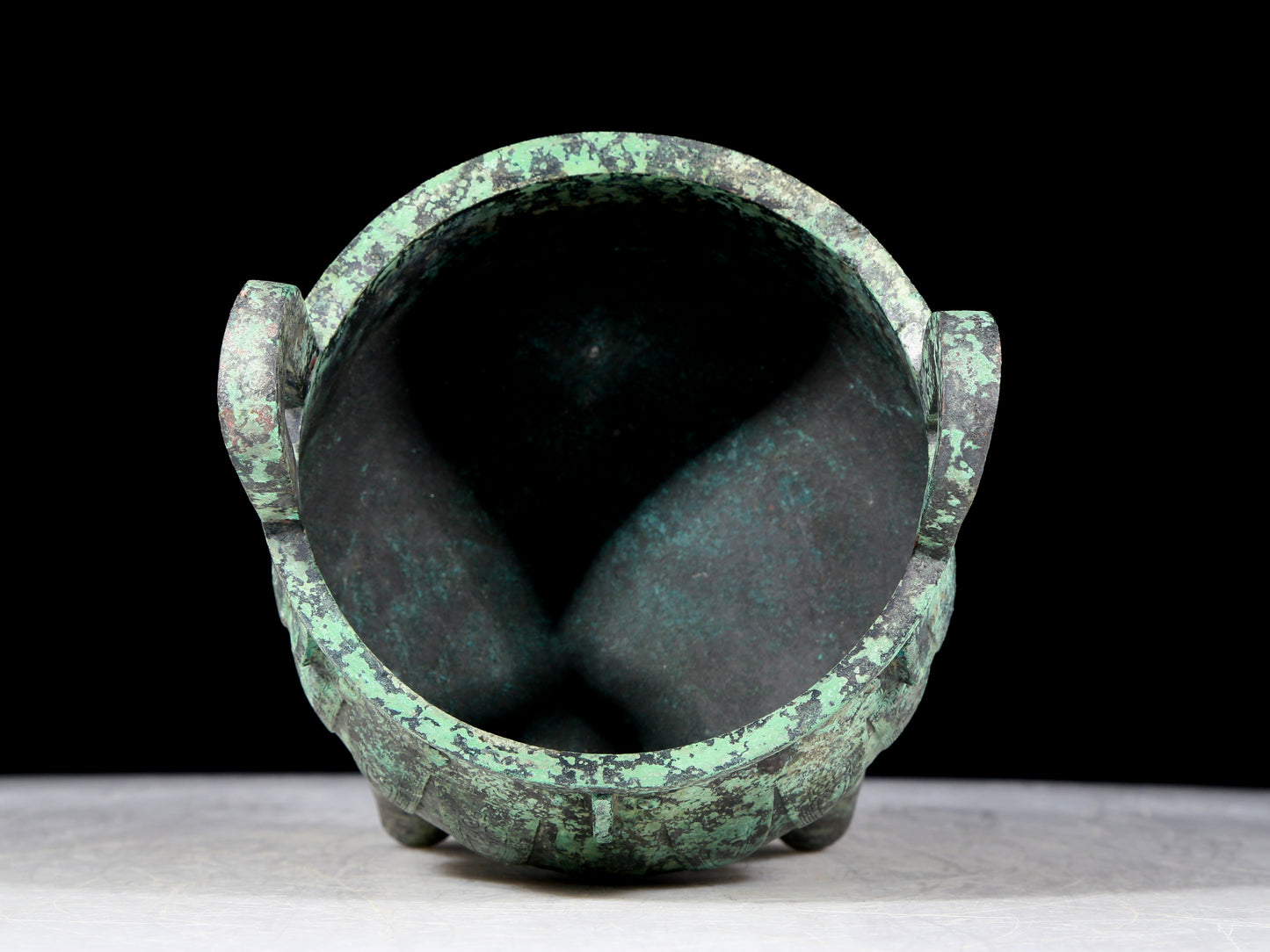 A precious bronze animal-faced two-eared and tripod furnace