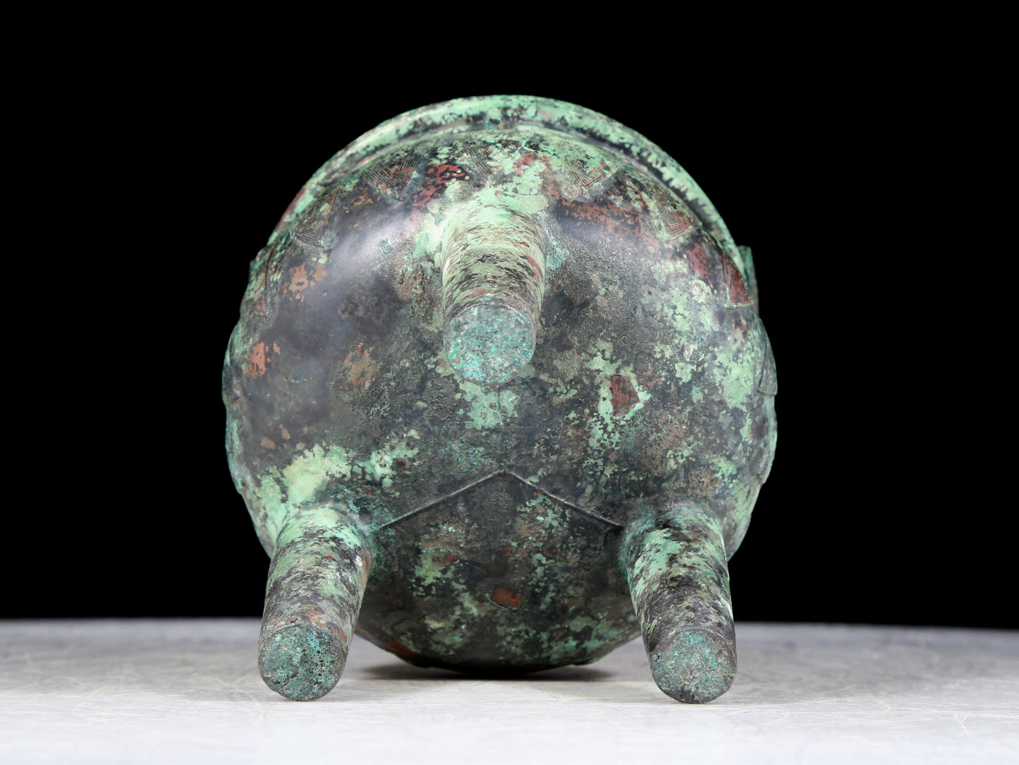 A precious bronze animal-faced two-eared and tripod furnace