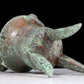 A precious bronze tripod cup with animal masks