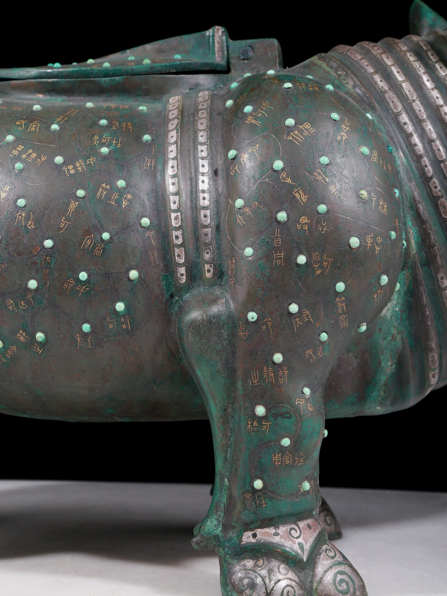 A precious bronze rhinoceros jar inlaid with gold and silver