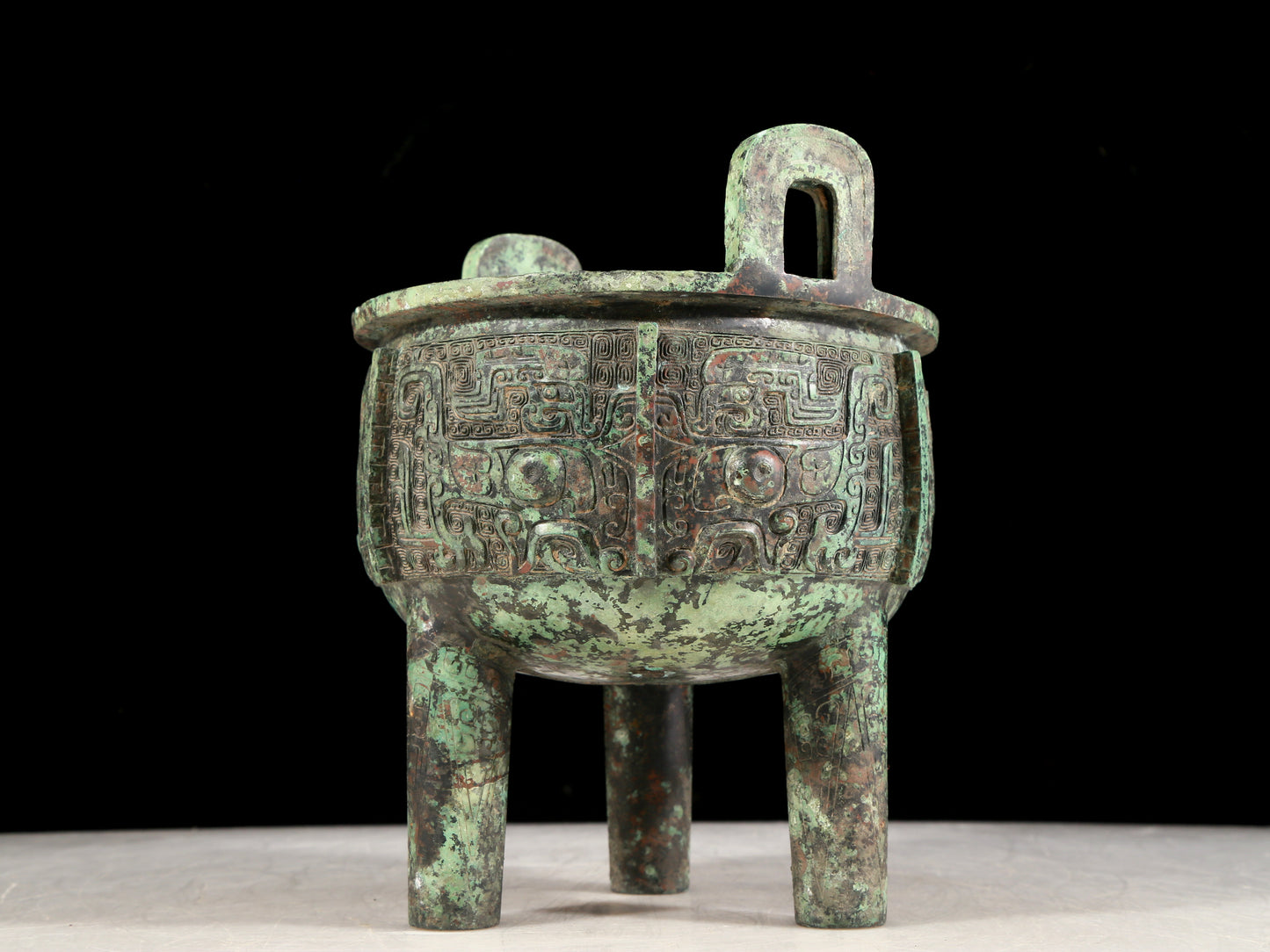 A precious bronze animal-faced two-eared and tripod censer