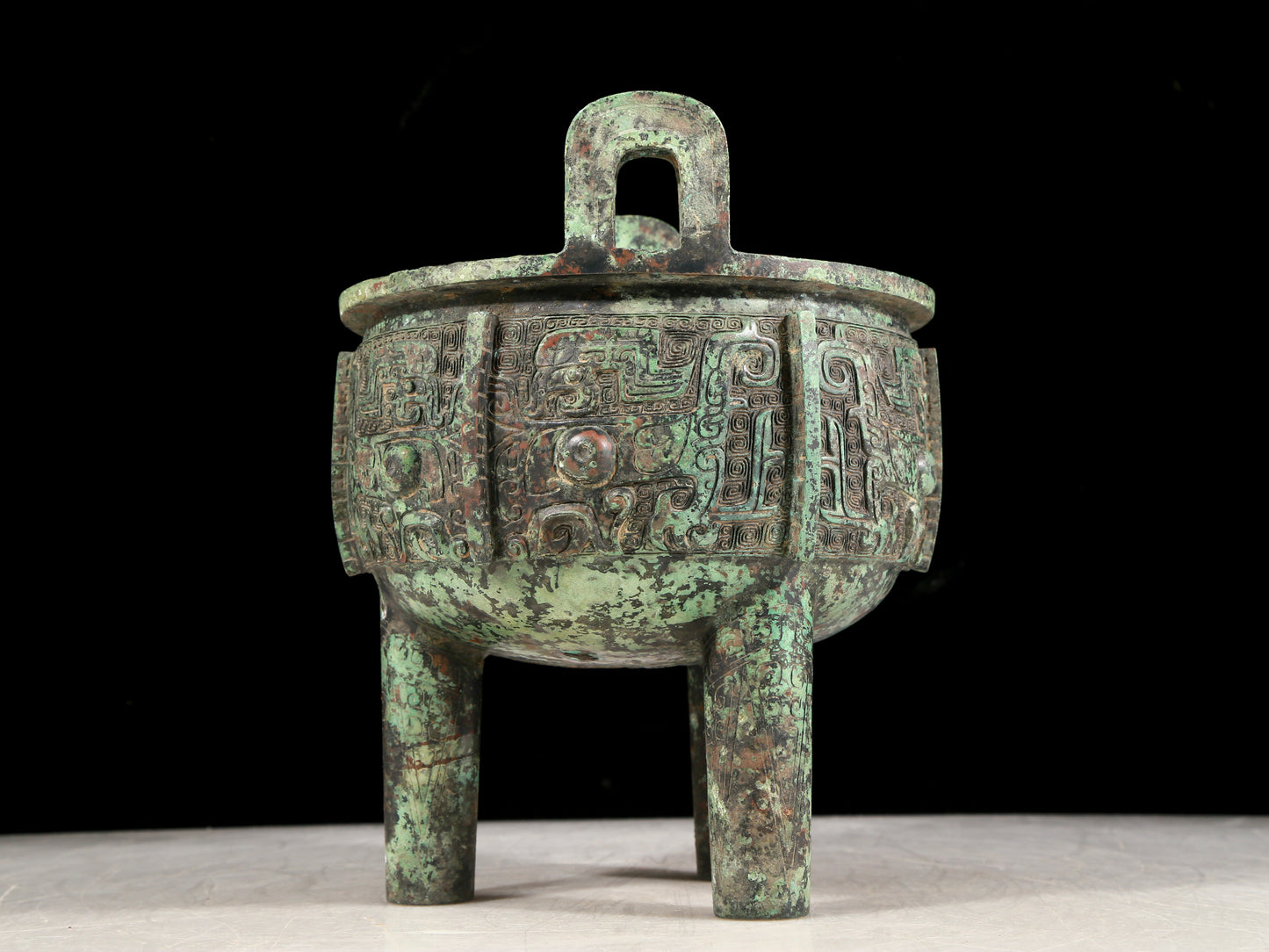 A precious bronze animal-faced two-eared and tripod censer