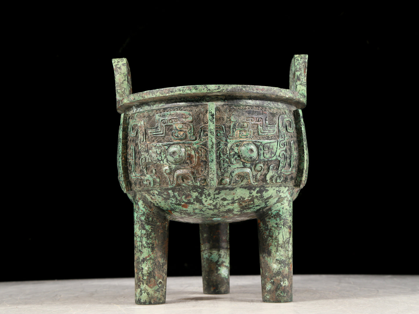 A precious bronze animal-faced two-eared and tripod censer